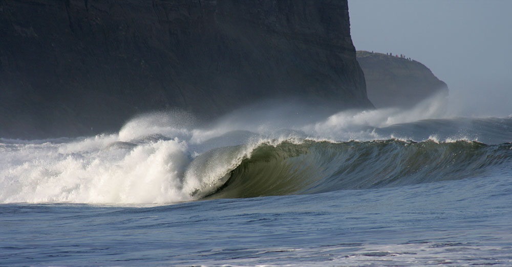 Surf with a big crowd on the headland